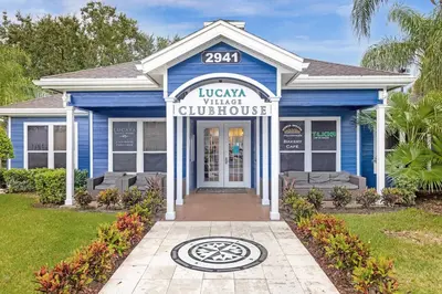 a blue house with a sign that reads loxka winter guidance at Family Getaway Near Disney Parks in Kissimmee