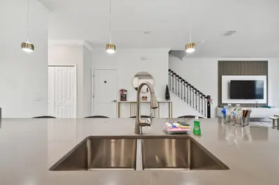 a kitchen with a stainless steel kitchen sink at Disney Getaway: Private Pool Resort in Kissimmee