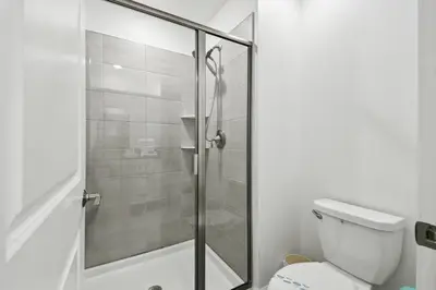 a bathroom with a shower and a toilet at Private Pool Luxury Resort Amenities in Kissimmee