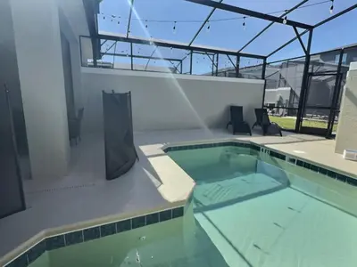 a swimming pool in the middle of a building at Luxury Home Near Disney Orlando in Kissimmee