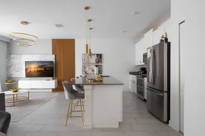 a kitchen with a stainless steel refrigerator and a counter at Luxury Family Stay Near Disney in Kissimmee
