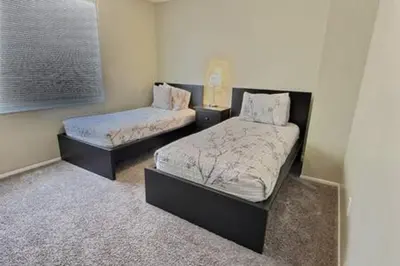 two beds in a small room at Montego Bay Retreat w Pool in Kissimmee