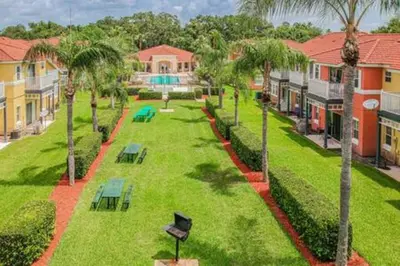 an aerial view of a park with palm trees and benches at Spacious Home · Near Disney Parks in Kissimmee