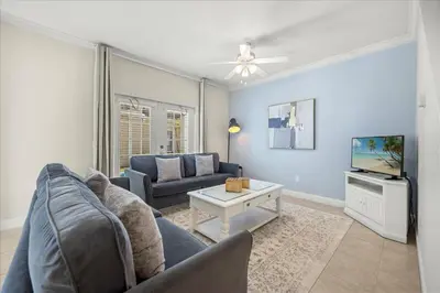 a living room with a couch and a tv at Orlando Family Stay · Pool Clubhouse in Kissimmee