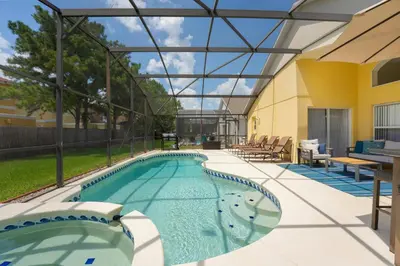 a large swimming pool with a glass roof at Two Master Suites Private Pool in Kissimmee