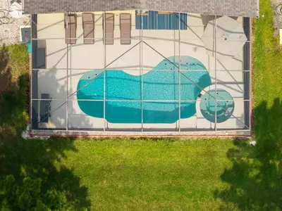 an overhead view of a swimming pool with a painting on it at Two Master Suites Private Pool in Kissimmee