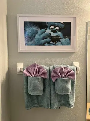 a picture of a monkey on a wall with towels at 3BR Windsor Hills Condo Water Park and Skeeball Near Disney No Resort Fees in Orlando