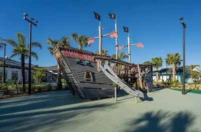 a playground in a park with a slide at Townhouse 4Q em Storey Lake – 10 min da Disney in Kissimmee