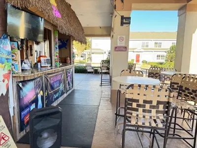 a restaurant with chairs and a table and a counter at 4 Bedroom 3 Bathroom Villas At SevenDwarfs 16-101 in Kissimmee