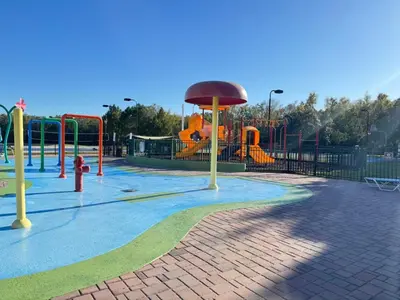 a park with a playground with a slide at 4 Bedroom 3 Bathroom Villas At SevenDwarfs 16-101 in Kissimmee