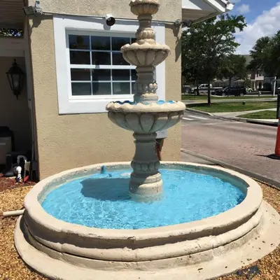 a water fountain in front of a building at Venetian Bay Townhome townhouse in Kissimmee