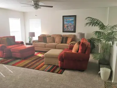 a living room with two couches and a couch at Berkeley Pool Home home in Kissimmee