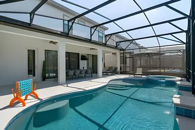 an indoor swimming pool with a glass ceiling at Casa 6Q Paradiso Grande. Piscina + Sala de Jogos in Orlando