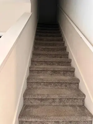 a staircase in a house with a stair case at Wharfside Waterfront in Kissimmee