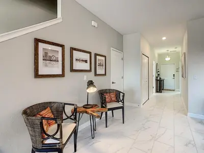 a dining room with two chairs and a table at 3065 - 5BR w Pool 10min Disney 2 Water Parks in Kissimmee