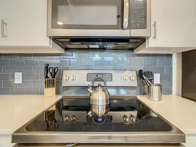 a tea kettle sitting on a stove in a kitchen at 4731#201- 3BR Condo 10min Disney 2 WaterParks in Kissimmee