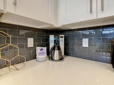 a coffee maker on a counter in a kitchen at 4731#301- 3BR Condo 10min Disney 2 WaterParks in Kissimmee