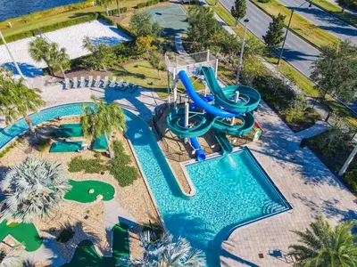 an aerial view of a water park with a water slide at 4731#308- 3BR Condo 10min Disney 2 WaterParks in Kissimmee