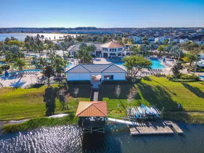 an aerial view of a house with a dock in the water at 4781 - 5BR w Pool 10min Disney 2 Water Parks in Kissimmee