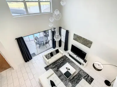 an overhead view of a living room with a tv at 4809 - 5BR w Pool 10min Disney 2 Water Parks in Kissimmee