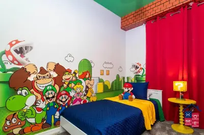 a bedroom with a cartoon mural on the wall at Lake View Condo with Resort in Kissimmee