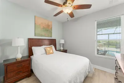 a bedroom with a bed and a ceiling fan at Windsor Hills View in Orlando