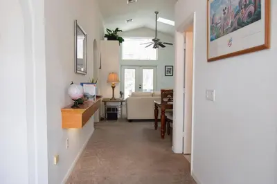 a hallway with a living room and a dining room at Free pool-spa heat - Near Disney - Nature view in Orlando