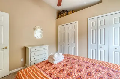 a bedroom with a bed and a white door at Safari Lodge in Orlando