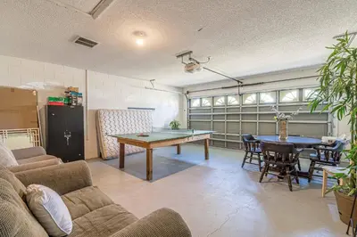 a living room with a ping pong table in it at Pool Paradise in Orlando