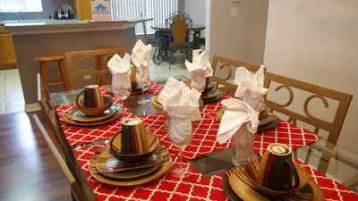 a table with plates and napkins on top at Minnie's Marvel in Kissimmee