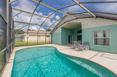 a swimming pool in a house with a glass ceiling at The Boat House in Orlando