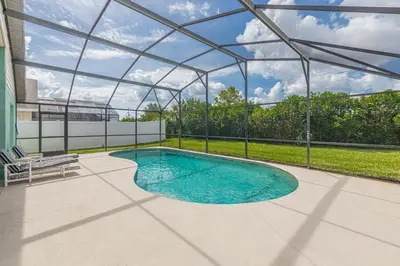 a swimming pool in a building with a glass roof at The Boat House in Orlando