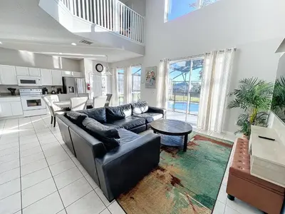 a large living room with a couch and a table at Island Paradise in Kissimmee