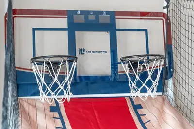 a basketball hoop with two baskets on a court at Lakefront Home with Game Room and Views in Kissimmee
