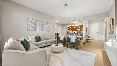 a living room with a couch and a dining room at Upstay Newly Renovated Family Retreat Home Near Epic Universe in Orlando