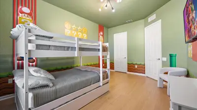 a childs bedroom with a bunk bed in a room at Upstay Newly Renovated Family Retreat Home Near Epic Universe in Orlando