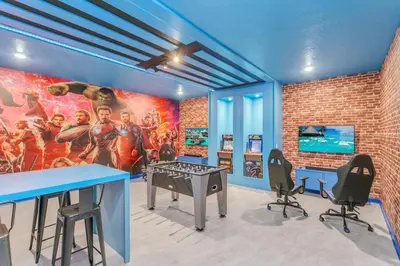 a room with a mural of the avengers at Huge 9-Bedroom Luxury Villa Near Disney With Pool in Kissimmee