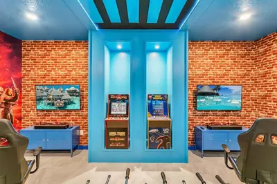 a room with two slot machines in a brick wall at Huge 9-Bedroom Luxury Villa Near Disney With Pool in Kissimmee