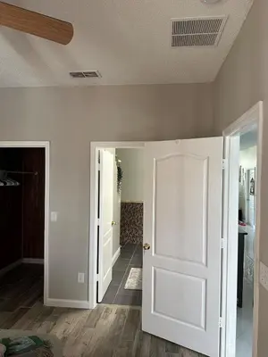 a room with white walls and a white door at Orlando Lakefront Pool Villa 25 min Disney & Univ in Orlando