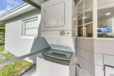 a toilet sitting on the side of a house at Gateway to Orlando Theme Parks! Home with Large Yard in Orlando