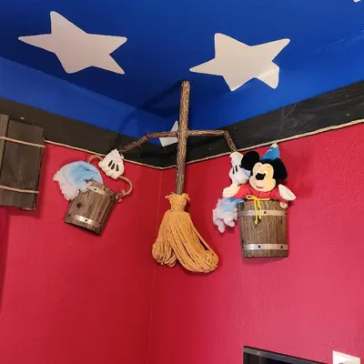 a group of stuffed animals are hanging on a wall at Mickeys Magical Escape in Orlando