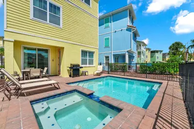 a swimming pool in the backyard of a house at A Parrot's Live For Me Cottage With Private Pool Near Disney With Margaritaville Resort & Island H20 Waterpark Access - 8028Sh in Orlando