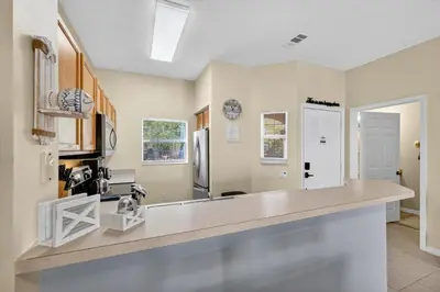 a kitchen with a counter top in a room at Modern Kissimmee Townhouse near Disney townhouse in Kissimmee