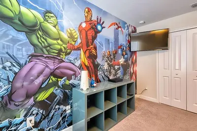 a bedroom with a superhero mural on the wall at Casa 6Q c/ Piscina + Temas Disney – Storey Lake in Kissimmee