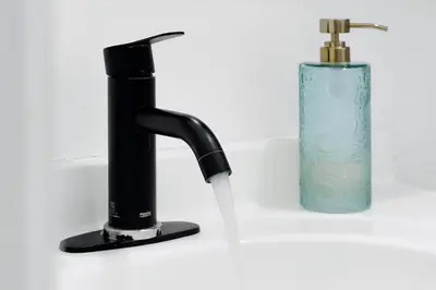 a black faucet with water coming out of it at Luxury Villa, Welcome to EDC, Pool & Spa in Orlando