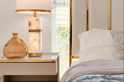 a bedroom with a bed and a vase on a night stand at Luxury Villa, Welcome to EDC, Pool & Spa in Orlando