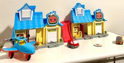 a toy house and a toy car on a table at Disney Pixie Dust Villa in Kissimmee