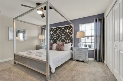 a bedroom with a canopy bed and a window at TVPM-4981WA/SL in Kissimmee