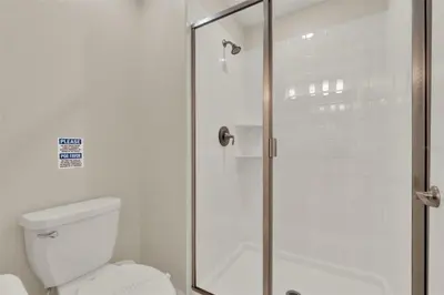 a bathroom with a shower with a toilet at TVPM-4981WA/SL in Kissimmee