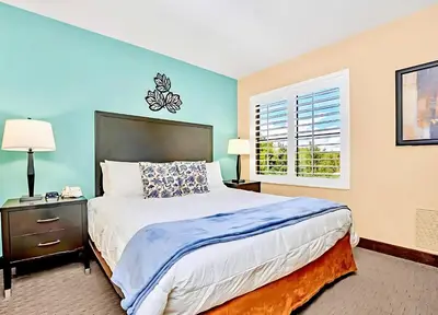 a bedroom with a large bed and a window at Family-Friendly 1BR Apartment close to Disney World in Orlando